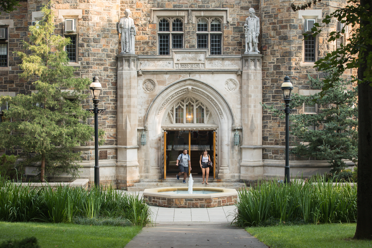 Entrance to Packard Lab with two students coming out of the doors