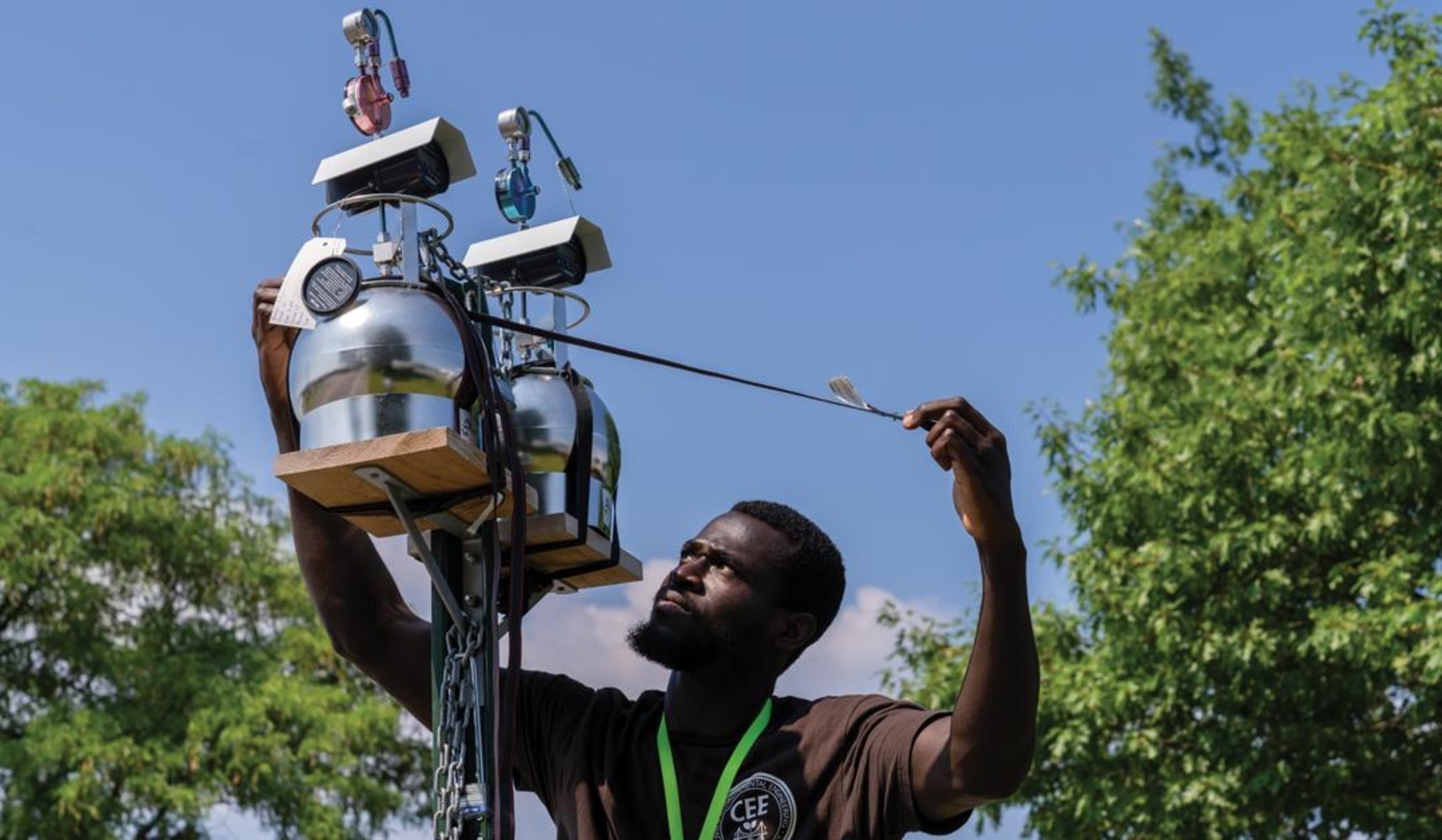 A student uses specialized equipmen to monitor air quality