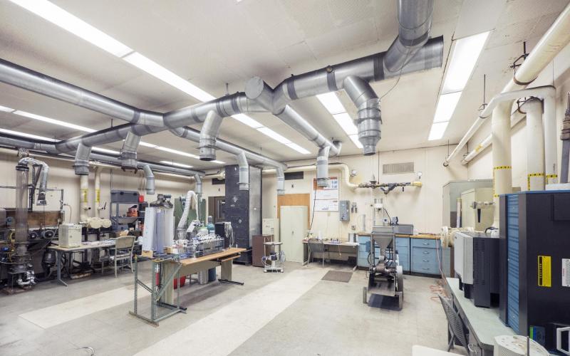 Large lab space with tubes coming down from the ceiling